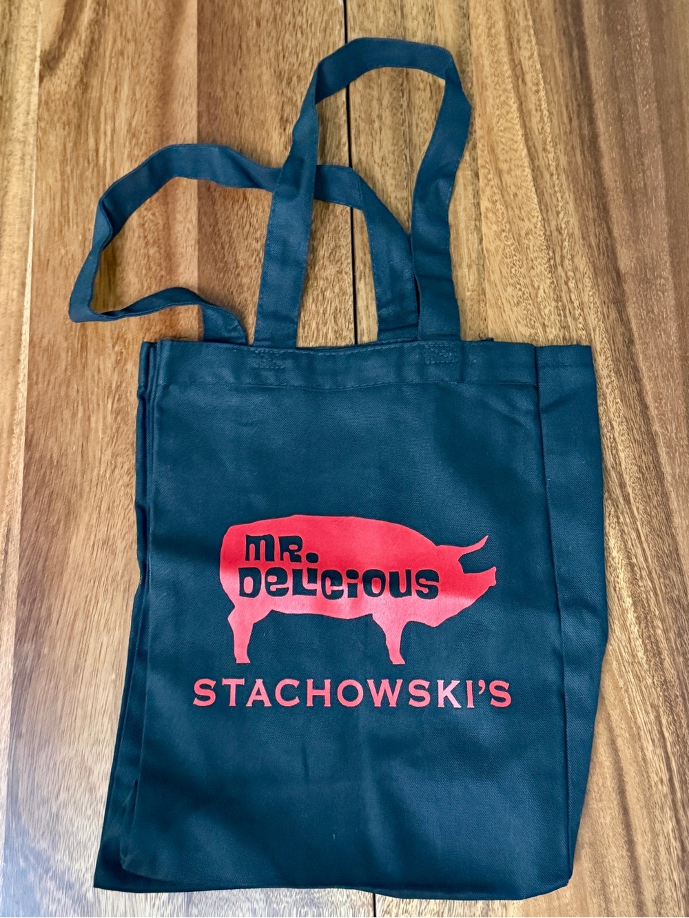 Mr. Delicious Black Tote Bag with Red Pig Logo